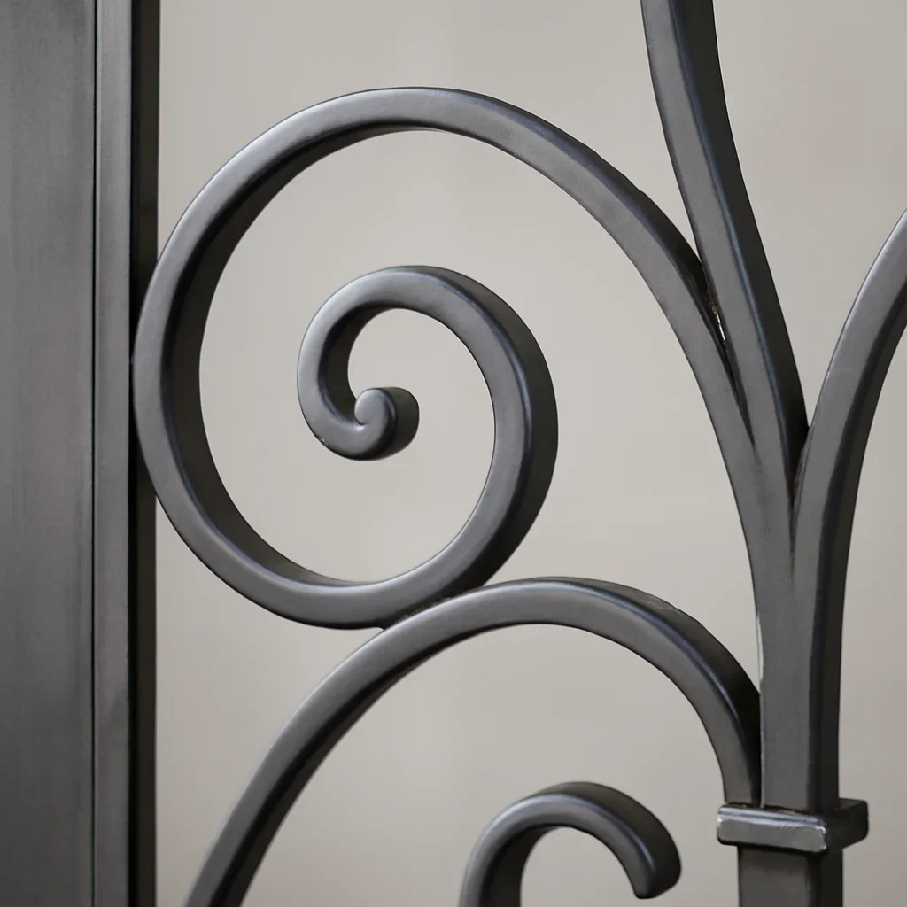 Close detail of ornamental metal fabrication showing pattern, finish and crafted metalwork